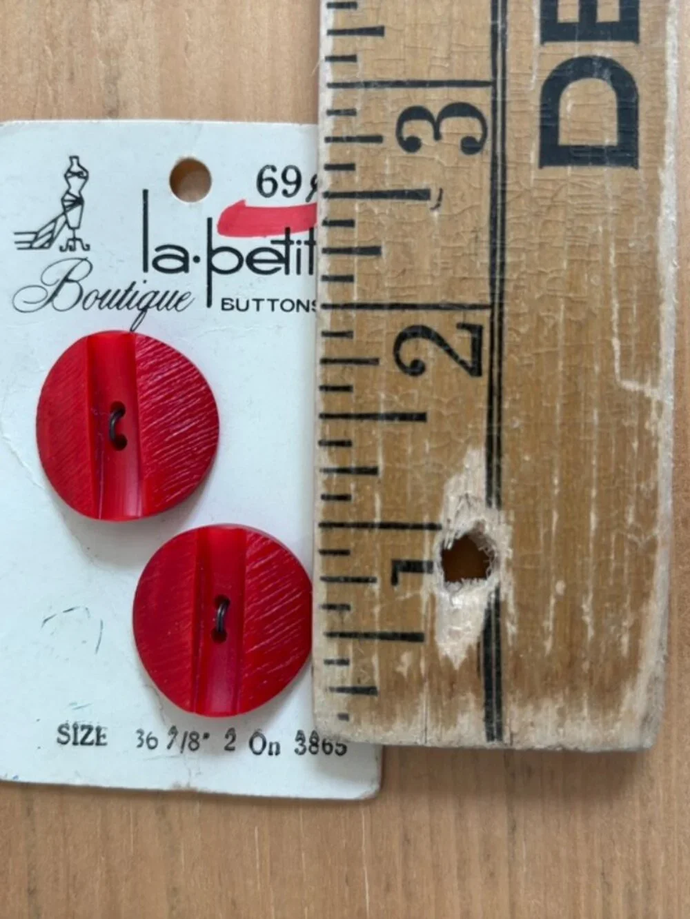 Lot of 2 NOS Vintage La Petite Boutique Red buttons on their original packaging.